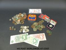 A collection of sundry coinage to include some cased 50 pence pieces, bank notes,