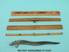 A letter opener in the form of a lizard with a horn section as the tail,