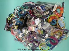 A collection of costume jewellery to include necklaces, bracelets,