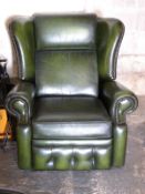 A Chesterfield style wingback armchair