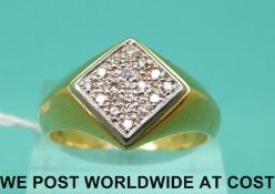 An 18ct gold ring set with diamonds in a square shaped setting,