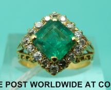 An 18ct gold ring set with a square emerald of approximately 1.