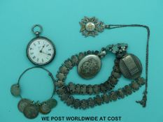 A Victorian white metal necklace with engraved decoration, two Victorian lockets,