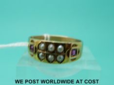 A Victorian 15ct gold ring set with seed pearls and rubies (size T)