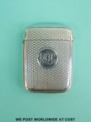 A Victorian hallmarked silver engine turned vesta case with gilt wash interior,
