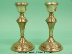 A pair of silver candle sticks, Birmingham 1961,
