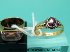 A 22ct gold ring set with a garnet (size P) and a 9ct gold ring set with amethyst (size J)