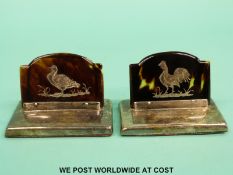 A pair of Asprey hallmarked silver place settings or menu holders with silver bird decoration