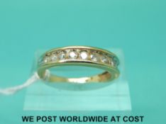 A 9ct gold half eternity ring set with eleven diamonds (size N)