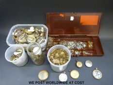A large quantity of pocket and wristwatch parts including 'thousands' of new balance wheels and