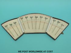 A cased set of 12 gilt white metal cockerel cocktail sticks in the Art Deco style,