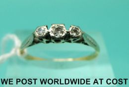 An 18ct gold ring set with three diamonds in a platinum setting (size P)