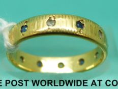 An 18ct gold ring set with sapphires (Size K, 2.