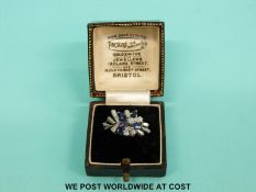 An 18ct white gold ring set with baguette cut diamonds and sapphires in original box