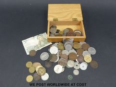 A small quantity of world coinage including Irish (small silver content) in a wooden box