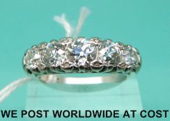 An 18ct white gold ring set with five old English cut diamonds totalling approximately 2.