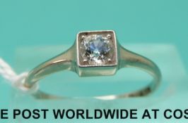An 18ct white gold ring set with an old cut diamond in a platinum square setting (size M)