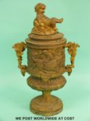 A gilt urn with cherubs to top and frieze (height 34cm)
