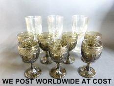 Seven pressed glass wine glasses and three large wine glasses