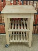 A kitchen or similar butcher's block style trolley with two slatted shelves below
