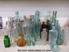 A collection of vintage stone jars and glass bottles