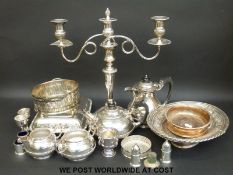 An Elkington silver plate four-piece tea set, swing handled dish, candelabra,