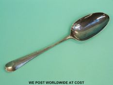 A HM silver bottom marked dessert spoon,