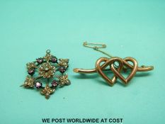 An Edwardian pendant marked 9ct set with seed pearls and pink stones together with a 9ct gold