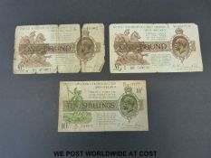 Three circulated Fenwick Warren Fisher bank notes comprising two green and brown £1 notes,