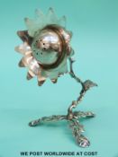 A white metal pepper or pot pourri formed as a flower,