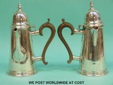 A pair of Georgian style Carrington & Co hallmarked silver coffee and hot water pots,
