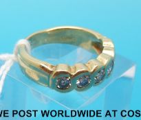 A white metal ring marked 14k set with six diamonds each measuring approximately 0.15ct.