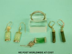 A pair of 9ct gold earrings set with jadeite, another yellow metal pair set with jadeite,