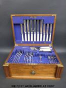 A part canteen of silver plated cutlery in fitted oak box
