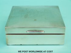 A hallmarked silver cigarette box with plain domed lid,