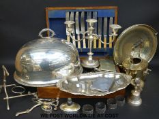 A quantity of silver plated items to include a spirit kettle, candelabra, part canteen of cutlery,
