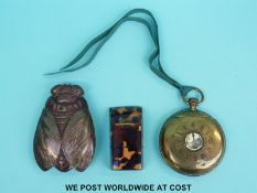 A bi-coloured metal novelty vesta in the form of a fly,