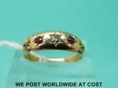 A 15ct gold ring set with a diamond and garnets (size N)