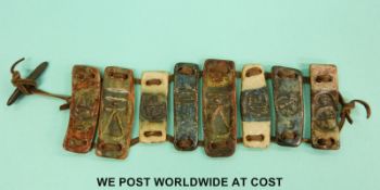 A studio pottery bracelet bracelet in the form of eight Troika style ceramic panels.