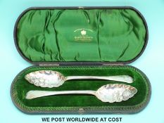 A cased pair of Victorian hallmarked silver berry spoons,