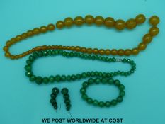 A string of graduated amber beads and a faceted aventurine quartz necklace,