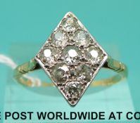 An 18ct gold ring set with nine old cut diamonds in a diamond shaped setting (size U)
