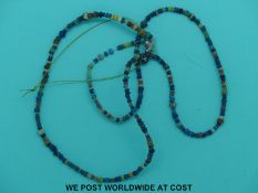 A string of Burma Myanmar 9th Century (Pyu) beads together with two larger beads from the same