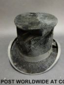 A small top hat by Harman & Son Hatters,