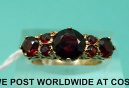 A 9ct gold ring set with garnets (size K)