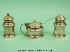 A hallmarked silver three piece cruet, Birmingham 1936, maker Bishtons Ltd (tallest 6.