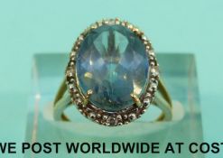 A 9ct gold ring set with topaz and diamonds (Size K, 3.