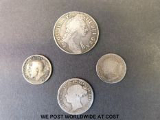 A William III shilling together with a Victorian sixpence,