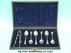 A boxed set of six Victorian silver teaspoons and matching tongs, Birmingham 1886,
