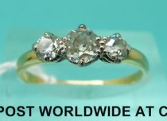 An 18ct gold ring set with three old cut diamonds (size O)
